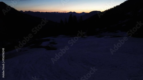 Aerial Drone Flight above Beautiful Mountain Landscape surrounded by forest. Bludenz, Austria, Europe photo