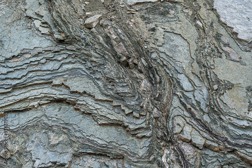 Slices of chondrite rock on the slopes of Caucasus mountains photo