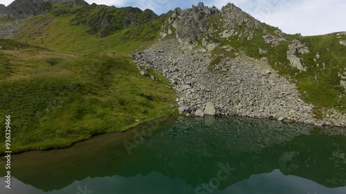 The Capra Lake. Drone Summer landscape of the Fagaras Mountains, Romania. photo