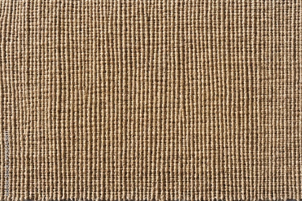 A detailed view of a rug against a warm, earthy brown background A detailed view of a rug against a warm, earthy brown background