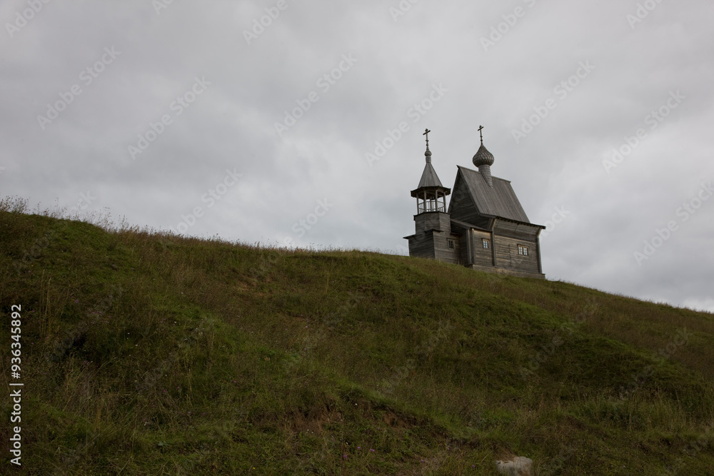Russia Arkhangelsk region, Kenozerye, wooden church on a cloudy summer day Russia Arkhangelsk region, Kenozerye, wooden church on a cloudy summer day