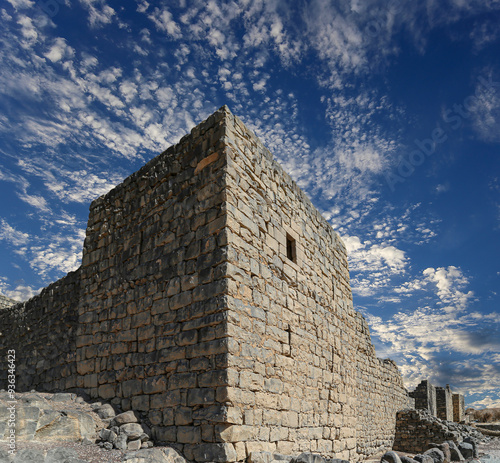 Ruins of Azraq Castle (Qasr al-Azraq) is a crusader castle (300AD), central-eastern Jordan, 100 km east of Amman, Jordan. Against the background of a beautiful sky with clouds