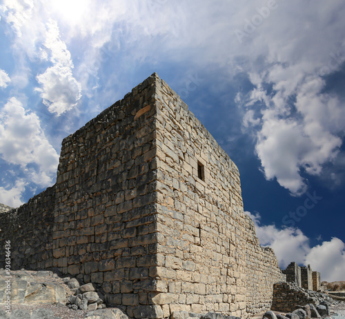 Ruins of Azraq Castle (Qasr al-Azraq) is a crusader castle (300AD), central-eastern Jordan, 100 km east of Amman, Jordan. Against the background of a beautiful sky with clouds