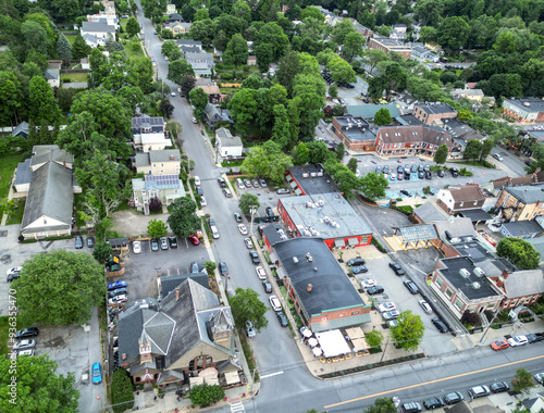 Wallpaper Mural aerial view of rhinebeck new york (hudson valley small town next to catskill mountains) trees main street homes businesses houses (residential and commercial downtown area) drone looking down sunset Torontodigital.ca