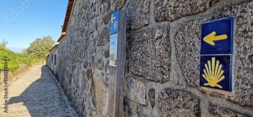 Yellow arrow and shell, symbols of Santiago de Compostela route