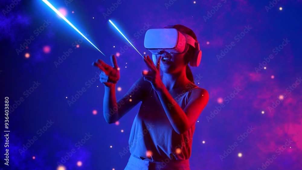 Fototapeta premium Excited smiling woman turning on VR looking transfer fantastic metaverse shooting bullet gun laser by hands in 3D hologram gaming space war with neon lighting bokeh galaxy cyberspace. Hallucination.