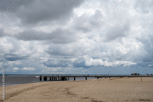 Walking on beach promenade in Arcachon, vacation destination town on Atlantic coast with beatiful parks, villas, streets and sandy beach, France
