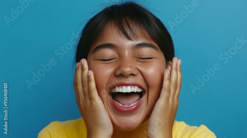 Woman expressing joy and relaxation indoors during a social gathering