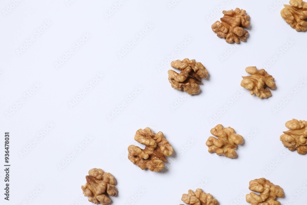 Walnuts on white background, top view