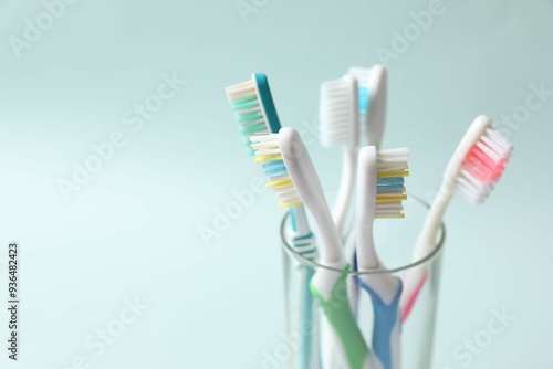 Various toothbrushes on a colored background. Concept of tooth treatment and dental care