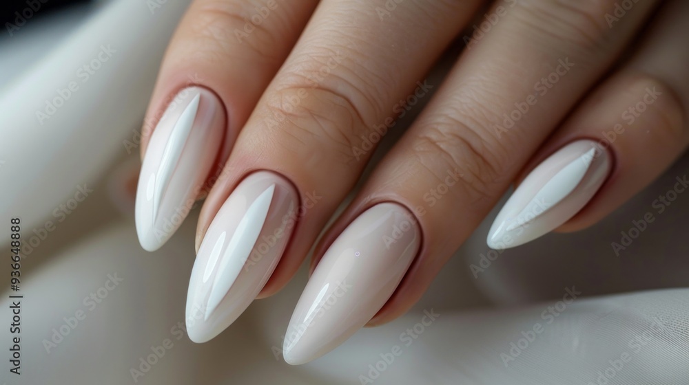 A well-manicured hand displays stunning long white stiletto nails with a polished finish, resting gracefully against a soft, neutral backdrop, highlighting modern nail art A well-manicured hand displays stunning long white stiletto nails with a polished finish, resting gracefully against a soft, neutral backdrop, highlighting modern nail art