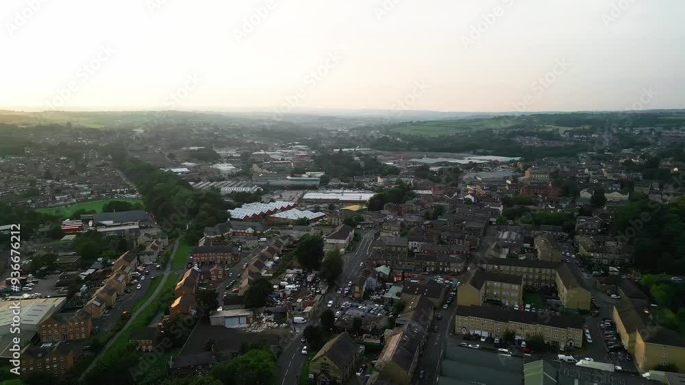 Heckmondwike, UK, captured by a drone, featuring industrial buildings, vibrant streets, the old town center, and the scenic Yorkshire view on a summer evening. Heckmondwike, UK, captured by a drone, featuring industrial buildings, vibrant streets, the old town center, and the scenic Yorkshire view on a summer evening.