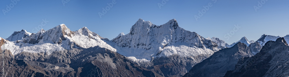 High mountain peaks in a chain of peaks crowned by glaciers with heights greater than six thousand meters standing out among the valleys of Peru. High mountain peaks in a chain of peaks crowned by glaciers with heights greater than six thousand meters standing out among the valleys of Peru.