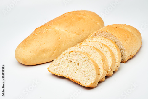 Freshly baked white bread loaf, sliced and ready to serve, perfect for sandwiches and breakfast