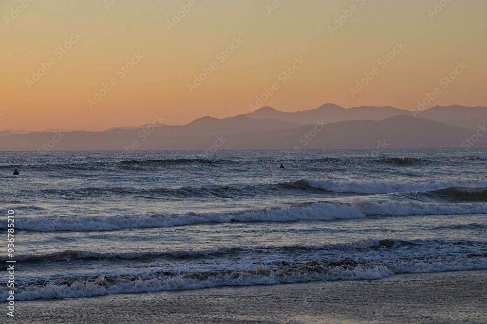 The sun sets over the Pacific in Morro Bay, California The sun sets over the Pacific in Morro Bay, California
