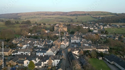 Slow Motion clip of the Cumbrian medieval village of Cartmel showing the historic Cartmel Priory at sunset photo