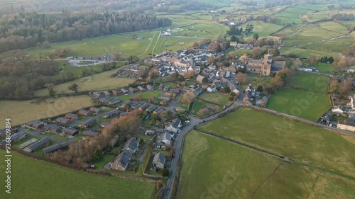 Slow Motion clip of the Cumbrian medieval village of Cartmel showing the historic Cartmel Priory at sunset photo