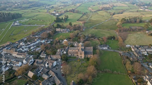 Slow Motion clip of the Cumbrian medieval village of Cartmel showing the historic Cartmel Priory at sunset photo