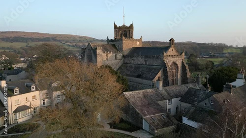 Slow Motion clip of the Cumbrian medieval village of Cartmel showing the historic Cartmel Priory at sunset photo