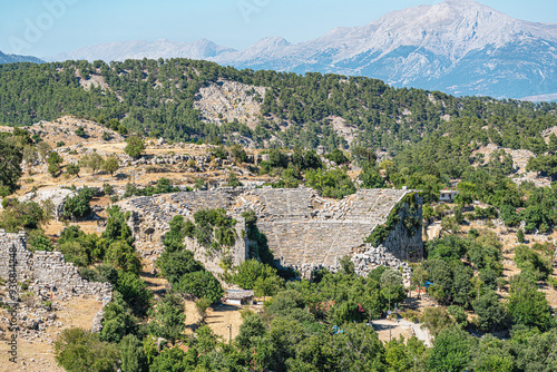 The scenic views of the ancient theater of Selge, which was an important city in ancient Pisidia and later in Pamphylia, on the slope of Mount Taurus, Antalya, Turkey photo