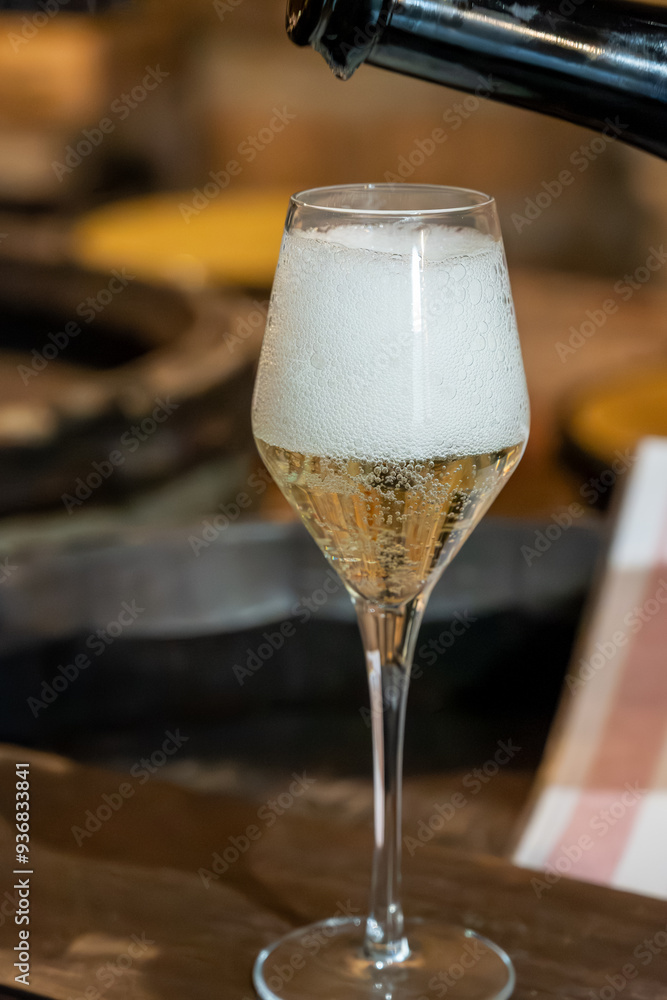 Tasting of grand cru sparkling brut white wine with bubbles champagne by old champagne caves in grand cru wine producer small village Cramant, Champagne, France Tasting of grand cru sparkling brut white wine with bubbles champagne by old champagne caves in grand cru wine producer small village Cramant, Champagne, France