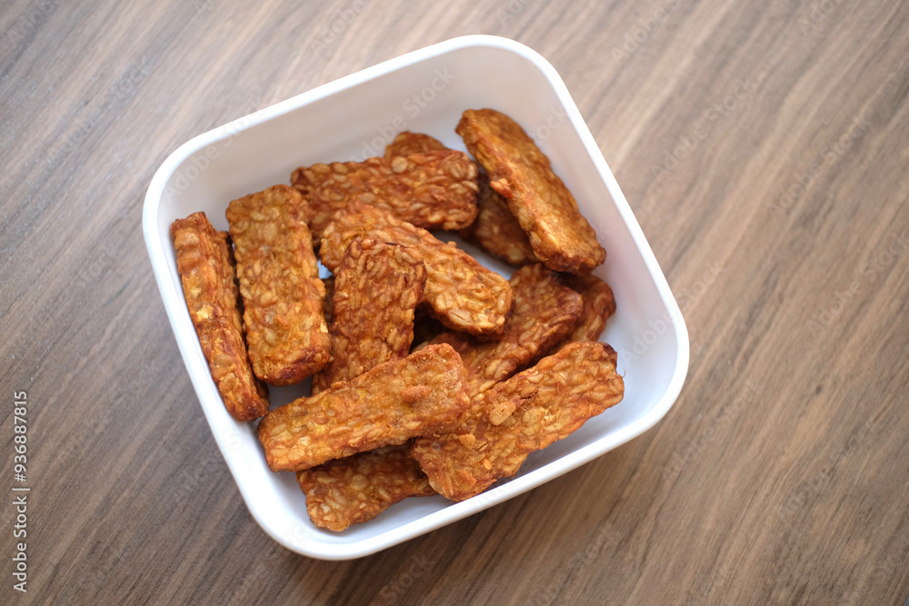Traditional indonesian culinary food. Tempe Goreng Indonesia Food that is simple and often made at home. Indonesian Street Food. Tempe goreng or fried tempe. Traditional indonesian culinary food. Tempe Goreng Indonesia Food that is simple and often made at home. Indonesian Street Food. Tempe goreng or fried tempe.