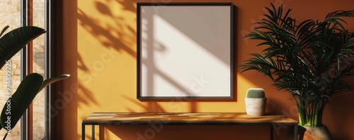 A white framed picture sits on a wooden table in a room with a yellow wall