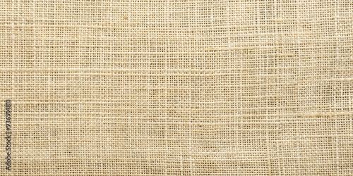 Light creme beige burlap jute sackcloth canvas background texture for design projects