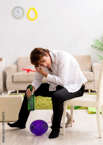 фотографія Young man having hangover after party