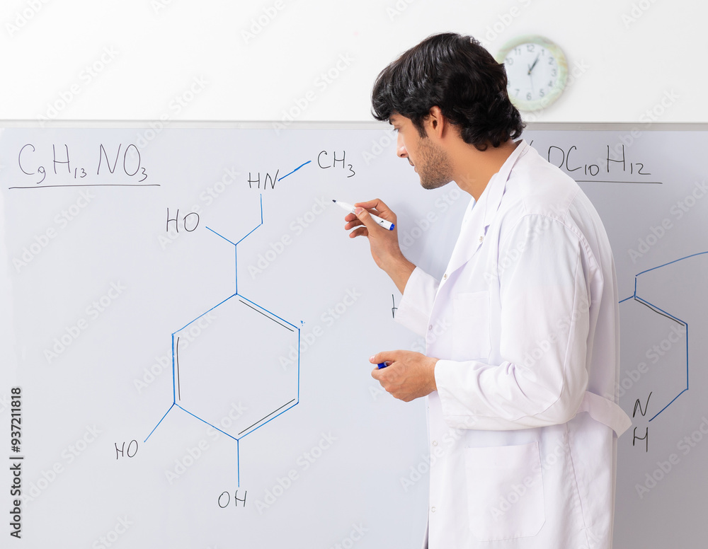Young student chemist in the classroom Young student chemist in the classroom
