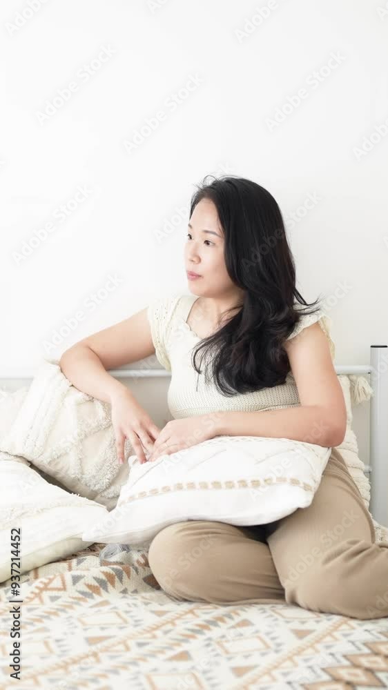 June in Selangor Malaysia Chinese Malaysian woman in her twenties and man in his thirties talking together on bed in room with stylish Western style furniture captured in slow motion vertical video June in Selangor Malaysia Chinese Malaysian woman in her twenties and man in his thirties talking together on bed in room with stylish Western style furniture captured in slow motion vertical video