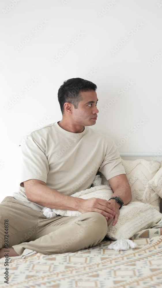 June in Selangor Malaysia Chinese Malaysian woman in her twenties and man in his thirties talking together on bed in room with stylish Western style furniture captured in slow motion vertical video June in Selangor Malaysia Chinese Malaysian woman in her twenties and man in his thirties talking together on bed in room with stylish Western style furniture captured in slow motion vertical video