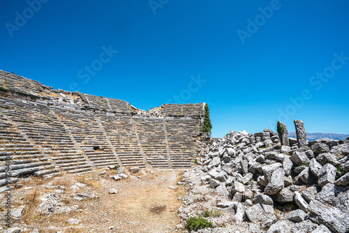 The scenic views of the ancient theater of Selge, which was an important city in ancient Pisidia and later in Pamphylia, on the slope of Mount Taurus, Antalya, Turkey photo