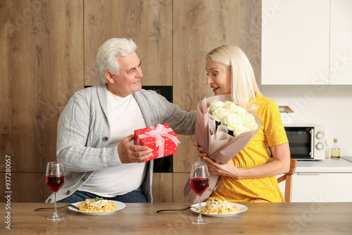 Mature woman receiving gift...
