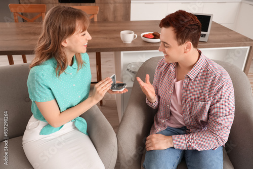 Young couple with hearing a...