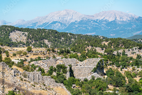 The scenic views of the ancient theater of Selge, which was an important city in ancient Pisidia and later in Pamphylia, on the slope of Mount Taurus, Antalya, Turkey photo