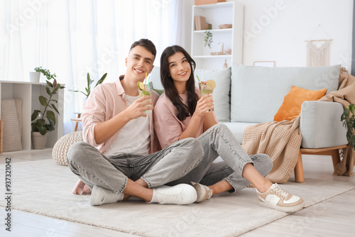Happy young couple with gla...