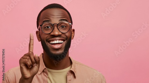 Unkempt man with glasses advertises new products on pink background.