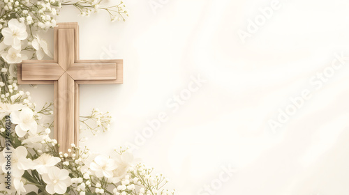 Composition with a Christian wooden cross and flowers against muted white background with copy space for text. Funeral template