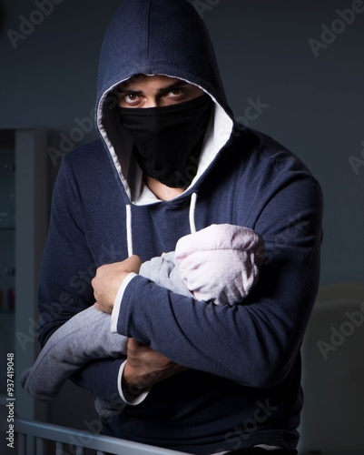 Obraz na płótnie Criminal stealing baby in human child traficking concept w salonie