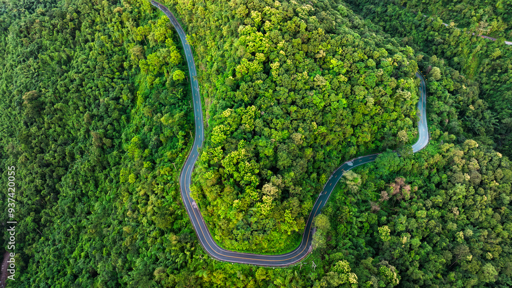 Aerial view of a road in the middle of the forest , road curve construction up to mountain
Aerial view of a road in the middle of the forest , road curve construction up to mountain