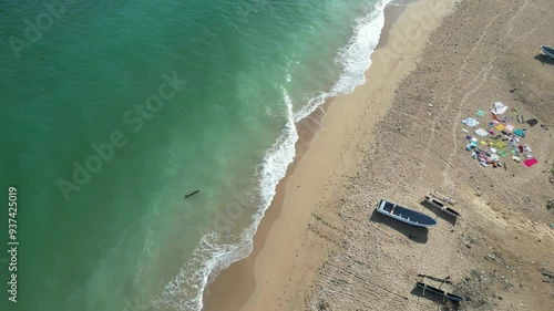 Aerial view of beach with boats and colorful textiles on Moheli Island, Comoros photo