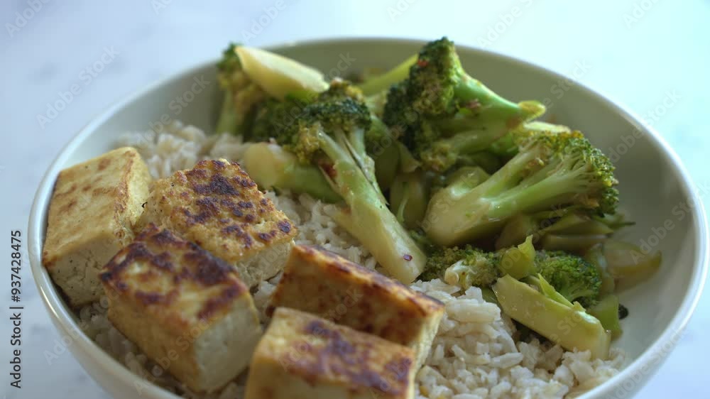 Plated brown rice tofu and broccoli on a spinning platter special ingredients to cook a meal two cans of beans rice plantain avocado red onion and cilantro Plated brown rice tofu and broccoli on a spinning platter special ingredients to cook a meal two cans of beans rice plantain avocado red onion and cilantro