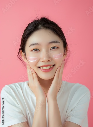 Smiling Asian Woman with Cream on Face