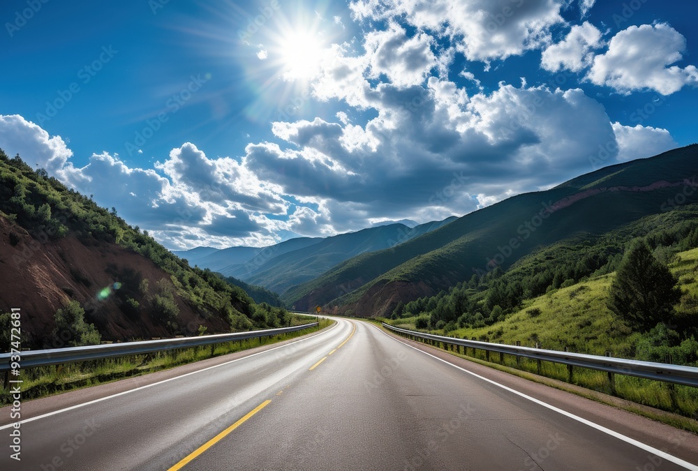 Winding Road Through Mountainous Landscape Under a Sunny Sky Winding Road Through Mountainous Landscape Under a Sunny Sky