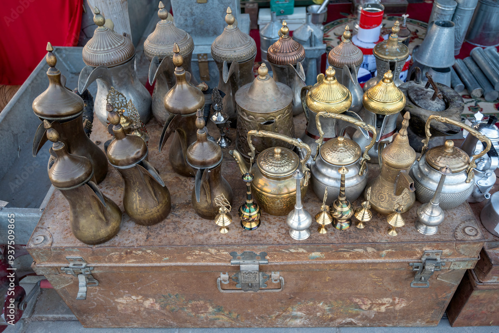 Old collection of ornate traditional omani metalware teapots and pitchers Old collection of ornate traditional omani metalware teapots and pitchers