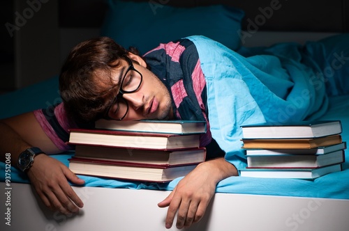 Obraz na płótnie Young student preparing for exams at night at home w salonie
