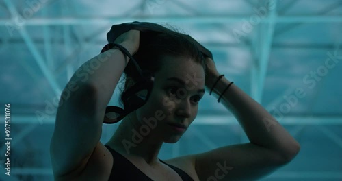 Woman putting a swimming cap on