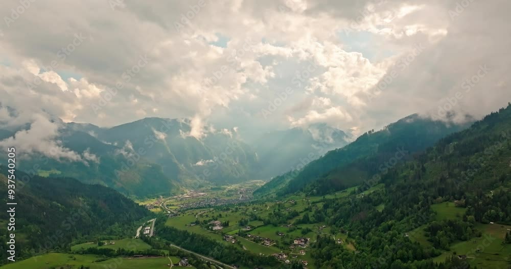 Aerial view of the nature landscape of the Alps. Mountain ranges and peaks are shrouded in clouds in magical nature. High quality 4k footage Aerial view of the nature landscape of the Alps. Mountain ranges and peaks are shrouded in clouds in magical nature. High quality 4k footage