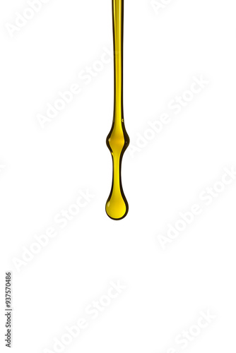 A single drop of yellow olive oil or oily cosmetic liquid suspended in the air against a white background, showcasing its glossy texture and fluidity. photo